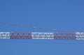 Part of arm machinery construction crane with blue sky background Royalty Free Stock Photo