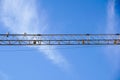 Part of arm machinery construction crane with blue sky background Royalty Free Stock Photo