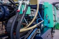 Part of automatic injection molding machine and plastic hoses at exhibition Royalty Free Stock Photo