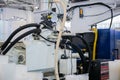 Part of automatic plastic injection molding machine during work Royalty Free Stock Photo