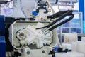 Part of automatic plastic injection molding machine during work Royalty Free Stock Photo