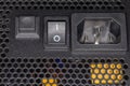 Part of back face of computer power supply close-up Royalty Free Stock Photo