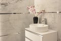 Part of the bathroom with a view of the washbasin with a tap.