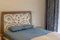 The interior in blue-beige of the bedroom