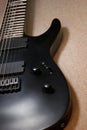 Part of black eight string electro guitar