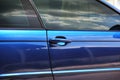 Part of a blue car. Car door close up Royalty Free Stock Photo