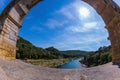 Part of the bridge. One bridge span is photographed lens Fisheye. Three-tiered aqueduct Pont du Gard - the highest in Europe. Royalty Free Stock Photo