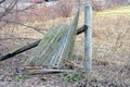 part of a broken old rural fence made of gray green wooden boards Royalty Free Stock Photo