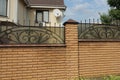 Part of a brown wall of a fence made of brown bricks Royalty Free Stock Photo