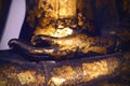 Part of Buddha statue carved in stone with hand.