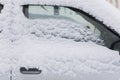 Part of a car covered with snow Royalty Free Stock Photo