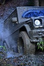 Part of car stuck in dirt, close up. Dirty tire