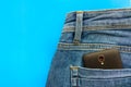 Part of cellphone in blue jeans back pocket Royalty Free Stock Photo