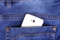 Part of cellphone in blue jeans pocket Royalty Free Stock Photo