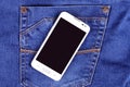 Part of cellphone on blue jeans pocket Royalty Free Stock Photo