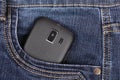 Part of cellphone in the pocket of blue jeans Royalty Free Stock Photo