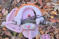 part of a childrens tricycle toy made of pink plastic steering wheel Royalty Free Stock Photo