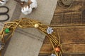 Part of a Christmas wreath painted in gold from natural materials. Decorating and items for creativity. Top view