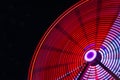 Part of a colorful ferris wheel at night Royalty Free Stock Photo