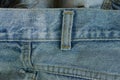Part of cotton old dirty blue gray frayed trousers made of fabric