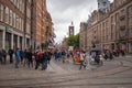 Part of Dam Square with pedestrians in center of Amsterdam at summer season Royalty Free Stock Photo