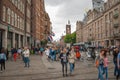 Part of Dam Square with pedestrians in center of Amsterdam at summer season Royalty Free Stock Photo