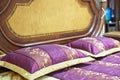 Part of a double bed with decorative headboard Royalty Free Stock Photo