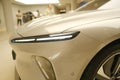 part of electric car NIO model ET7, headlights all-electric premium sedan, electric vehicle in showroom, alternative energy