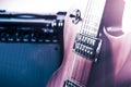 Part electric guitar and classic amplifier on a dark background