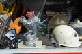 Part of equipment of a firetruck: hoses, valves, syringe of a water pump, helmet, ropes and axe.