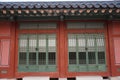 Part of the facade with a closed window of an ancient Korean palace building. Deoksugung Palace, Seoul