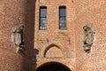 Part of the facade of the historic city gate decorated with sculptures of lions