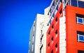 Part of the facade modern building with red and blue Royalty Free Stock Photo