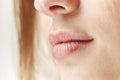 Part of face,young woman close up. Plump lips without makeup Royalty Free Stock Photo