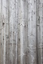 Part of fence with grey weathered planks