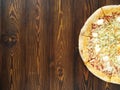 Part of Four cheese pizza with Dor-blue, Parmesan, feta, oregano, mozzarella, tomato sauce, top view with copy space. Royalty Free Stock Photo