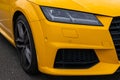 Part of the front of a yellow racing car Royalty Free Stock Photo