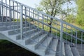 Part of a gray pedestrian bridge made of concrete steps Royalty Free Stock Photo