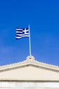 Part of a greek building with the greek flag Royalty Free Stock Photo