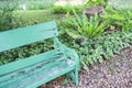 Part of green wooden bench in park Royalty Free Stock Photo