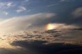 A part of a halo light effect in the evening sky between clouds Royalty Free Stock Photo