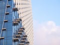 Part of a high-rise building under construction. End of construction. Finished works. Facade of a new beautiful skyscraper. Modern