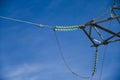 Part of a high voltage power tower with glass insulators close-up Royalty Free Stock Photo