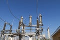 Part of high-voltage substation on blue sky background with switches and disconnectors. Ukrainian energy infrastructure