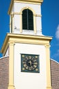 Part of historic bell tower with clock on a church in Holland Royalty Free Stock Photo