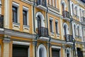Part of the house with a row of windows and black iron balconies Royalty Free Stock Photo
