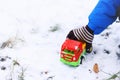 Part of the image of a child who plays among the first snow with Royalty Free Stock Photo