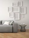 Part of interior with grey sofa and frames 3D rendering Royalty Free Stock Photo