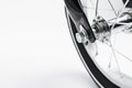 Part of kids bicycle wheel with spokes, white background
