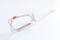 Part of kitchen mixer whisk on white background. Metallic bright with reflection Royalty Free Stock Photo